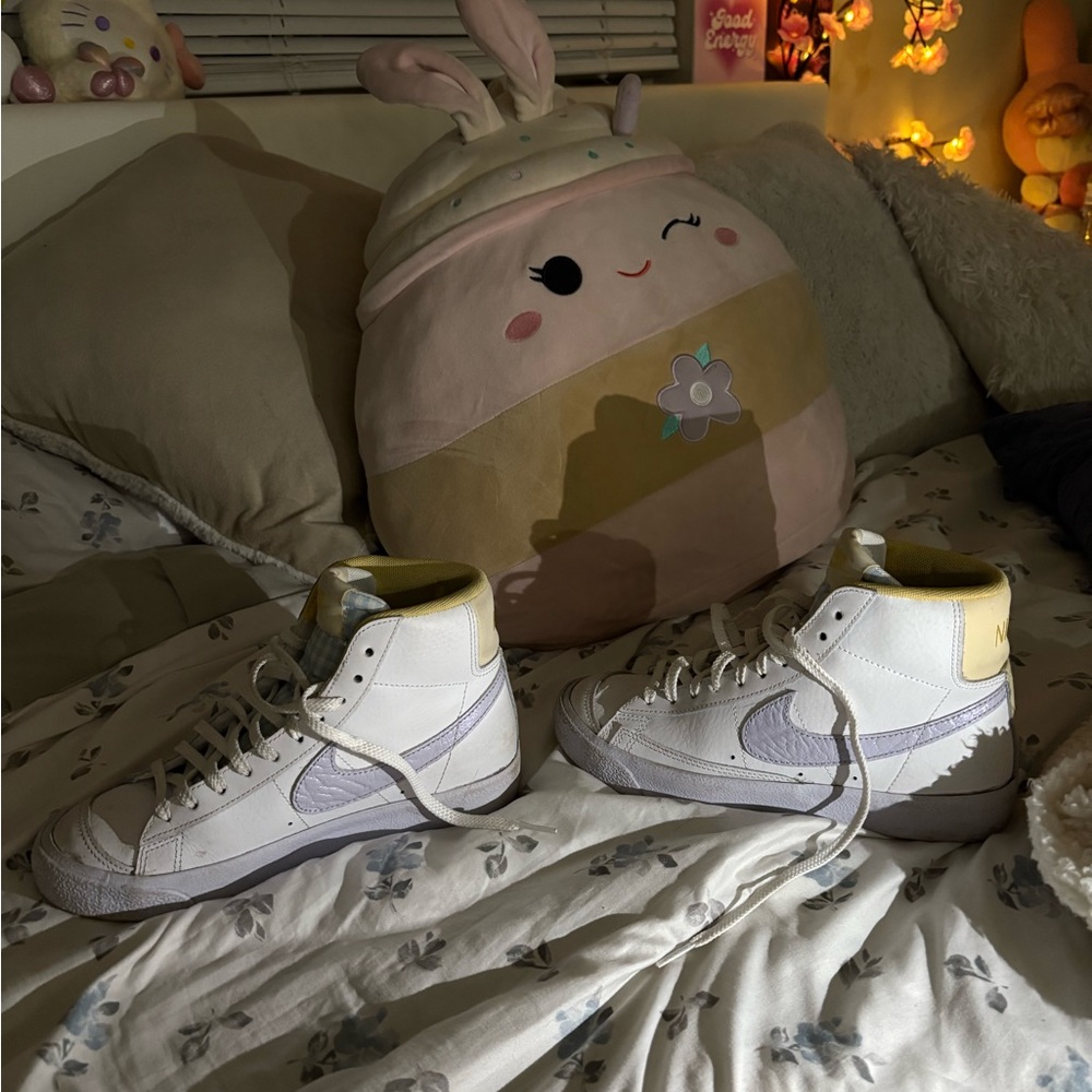 White and Purple High-Top Nike Sneakers